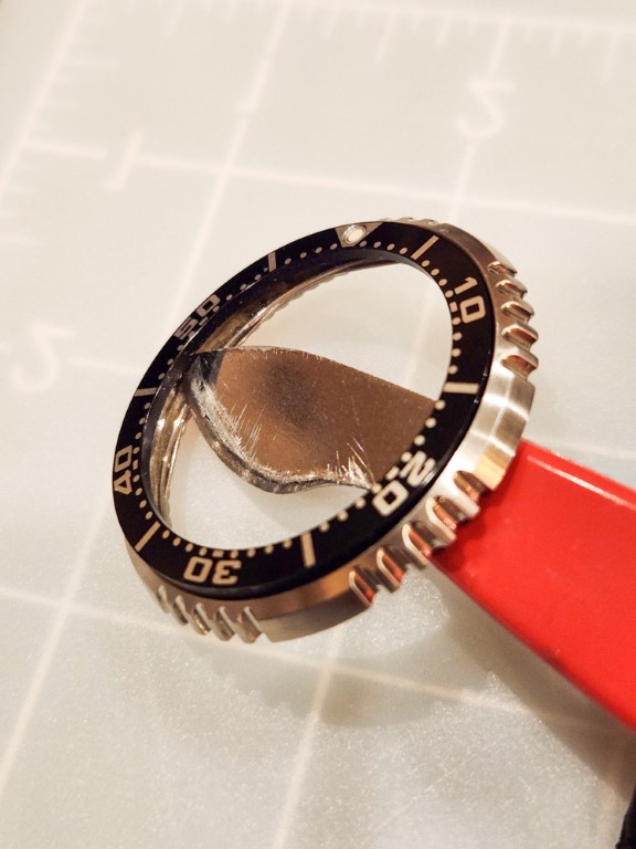Removing the original bezel insert from the underside