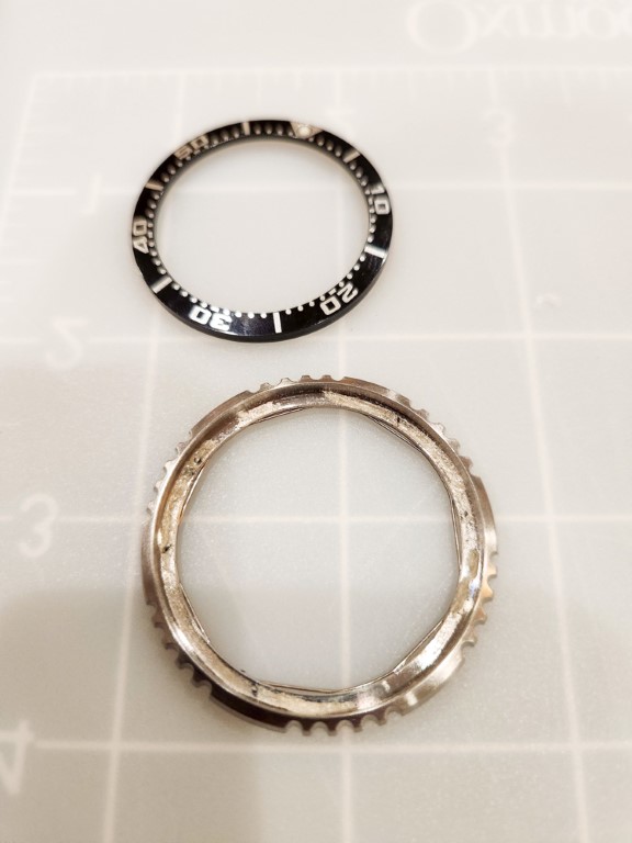 Bezel after the original insert has been removed